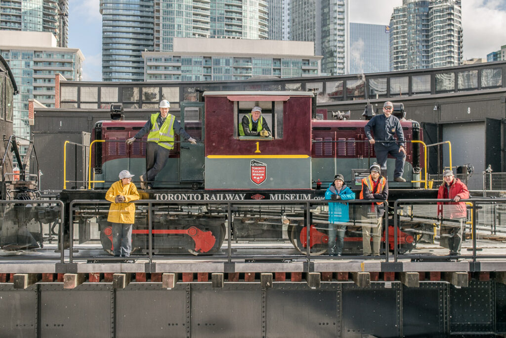 Members of the restorations crew with our locomotive No.1. The locomotive sits on the museum turntable. 