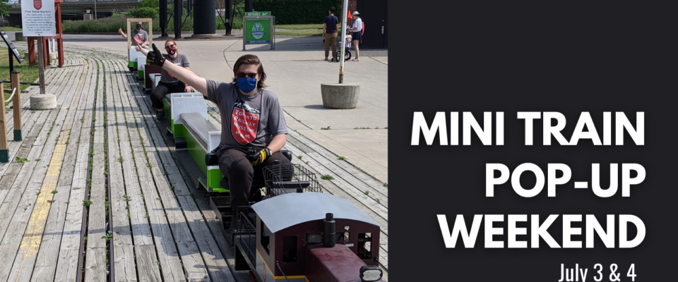 Musuem staff members prepare the miniature train for the july pop up event