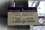 Metrolinx sign on train platform with crisis phoneline information