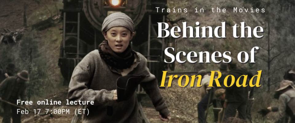 An actor from the film Iron Road is running towards the viewer along train tracks. Behind them is a black steam train. Small groups of workers are dotted along the edge of the tracks. Text reads Trains in the Movies: Behind the Scenes of Iron Road. Free online lecture, February 17, 7:00 p.m. eastern time.