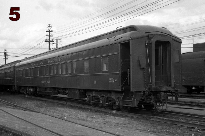 Black and white photo of a dental car parked in the yard at the John Street Roundhouse.