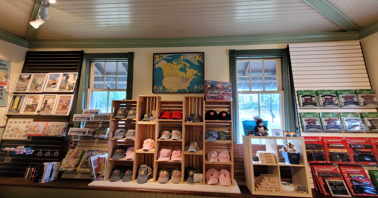 gift shop shelves stocked with hats and toy trains