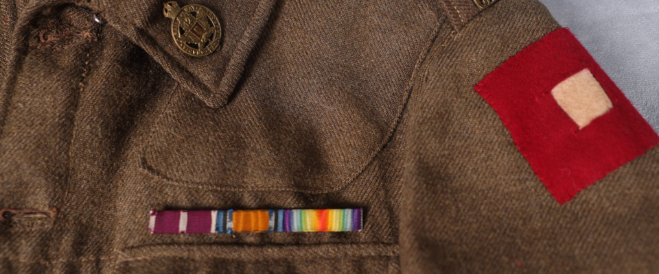 Military uniform jacket with ribbons, patches